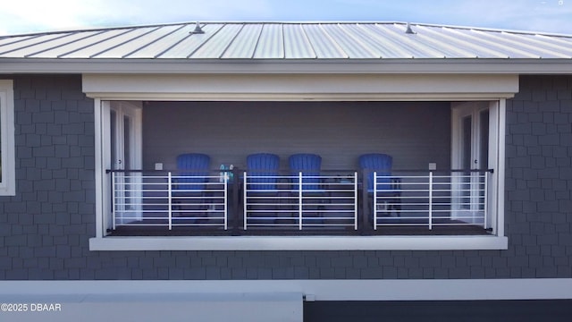 exterior details featuring metal roof and a standing seam roof