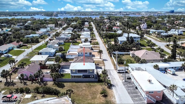 bird's eye view with a water view and a residential view