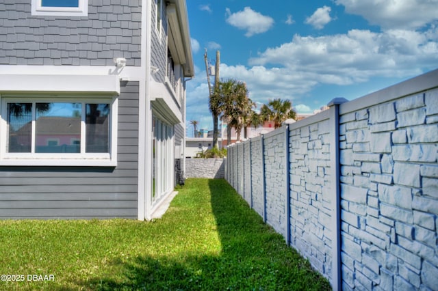 view of yard with a fenced backyard