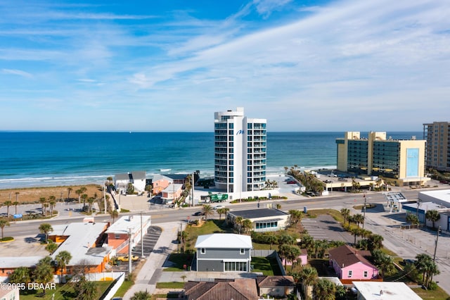 drone / aerial view with a beach view and a water view