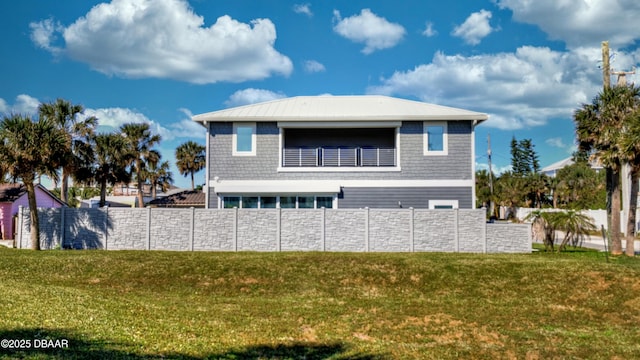 back of property with fence and a yard