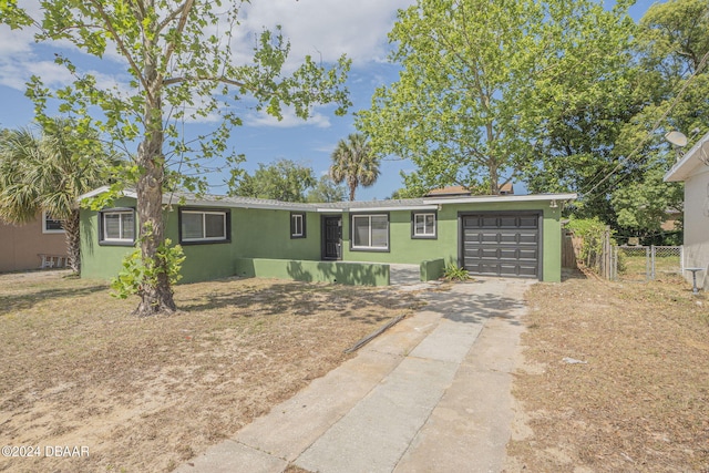 ranch-style home with a garage