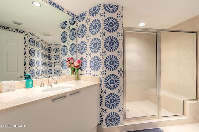 full bath featuring a stall shower, recessed lighting, visible vents, and vanity