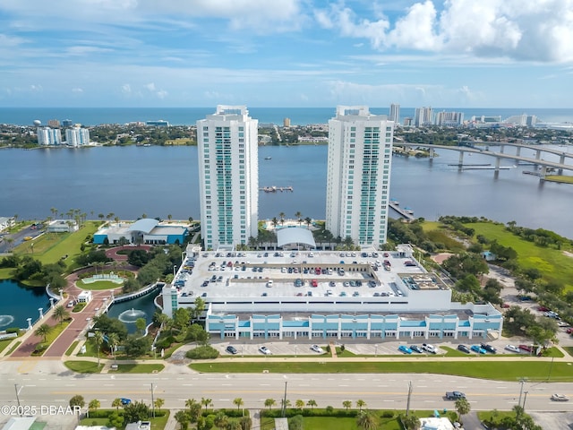 birds eye view of property featuring a water view and a city view