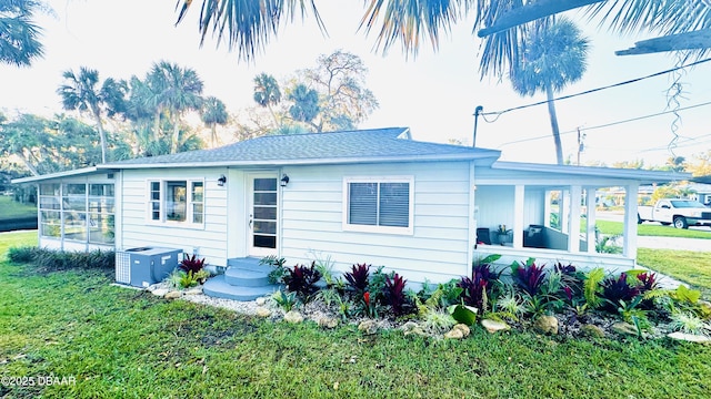 rear view of house with a lawn