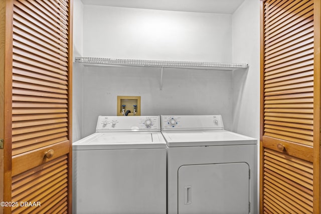 washroom with washer and dryer