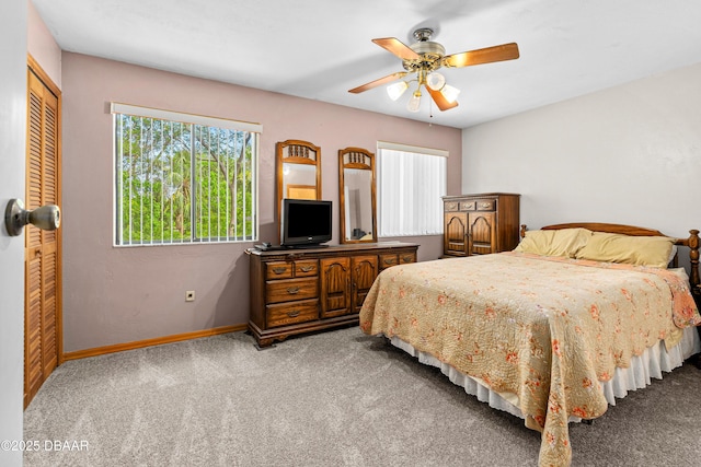 bedroom featuring carpet flooring, baseboards, and a ceiling fan