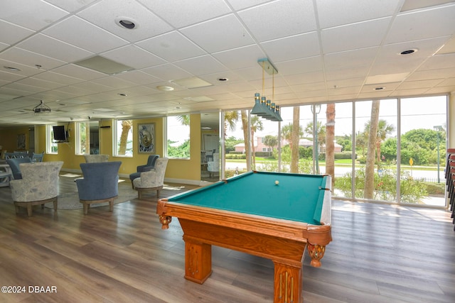 playroom featuring pool table, a wealth of natural light, wood-type flooring, and a drop ceiling