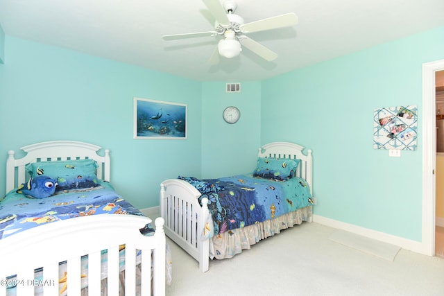 bedroom featuring light carpet and ceiling fan