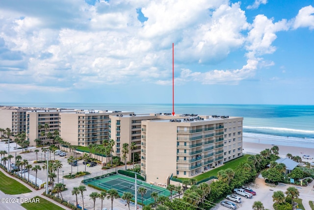 bird's eye view featuring a view of the beach and a water view