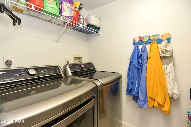 washroom with washer and dryer