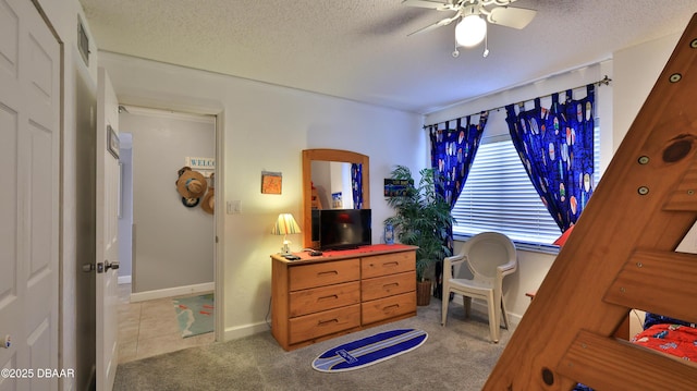 4139 S Atlantic Ave Unit B204, New Smyrna Beach, FL 32169 - bedroom with a textured ceiling, carpet floors, and a ceiling fan