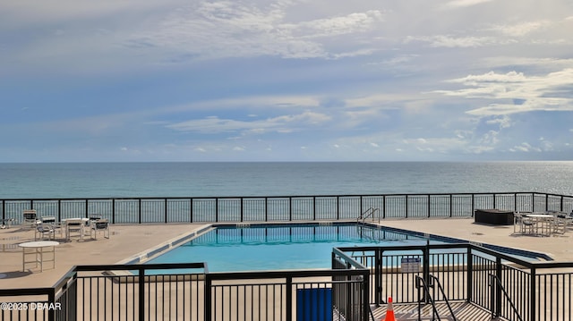 4139 S Atlantic Ave Unit B204, New Smyrna Beach, FL 32169 - community pool featuring a water view and a patio