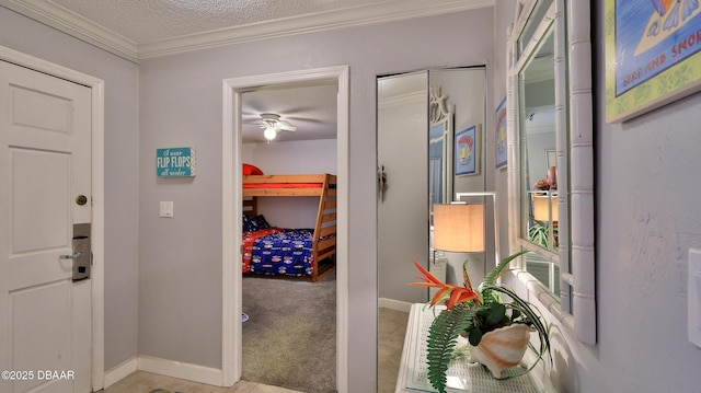 4139 S Atlantic Ave Unit B204, New Smyrna Beach, FL 32169 - hallway featuring a textured ceiling and ornamental molding