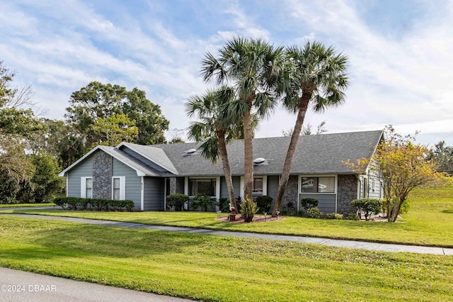 single story home featuring a front yard