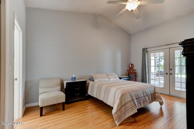 bedroom with a ceiling fan, lofted ceiling, access to exterior, french doors, and light wood-type flooring