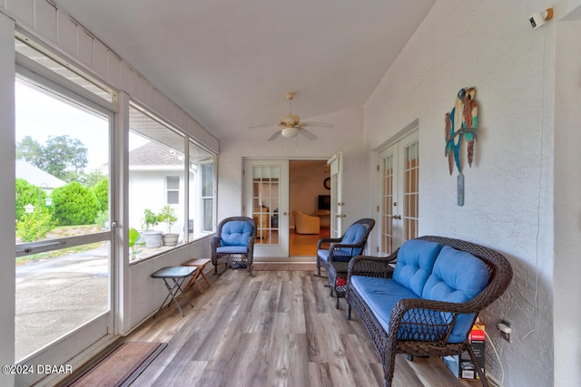 sunroom featuring vaulted ceiling, french doors, and a ceiling fan