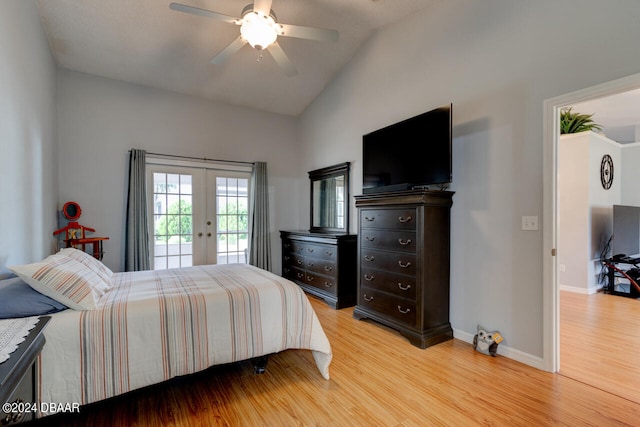 bedroom featuring french doors, lofted ceiling, light wood-style floors, access to outside, and baseboards