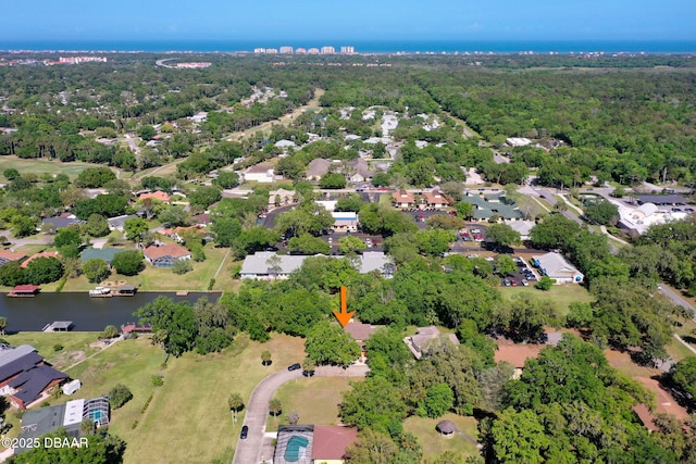 bird's eye view with a water view, a residential view, and a forest view