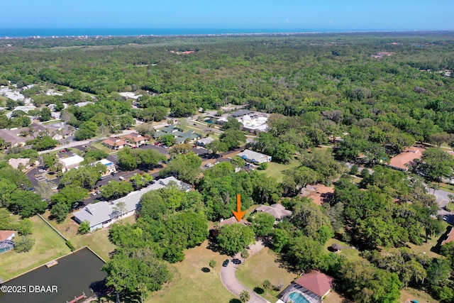 bird's eye view featuring a view of trees and a residential view