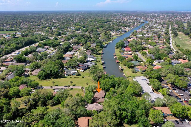 birds eye view of property with a water view and a residential view