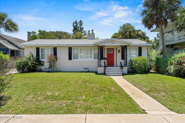 ranch-style house featuring a front yard