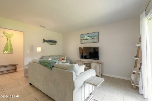 living room with light tile patterned floors