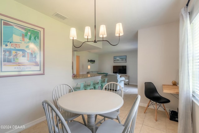 415 Banana Cay Dr Unit F, South Daytona, FL 32119 - dining space with light tile patterned flooring and baseboards