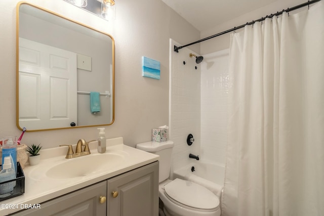 full bathroom featuring vanity, shower / bath combination with curtain, and toilet