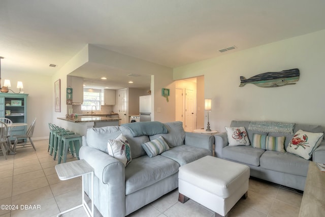 415 Banana Cay Dr Unit F, South Daytona, FL 32119 - living room with light tile patterned flooring, a chandelier, and recessed lighting