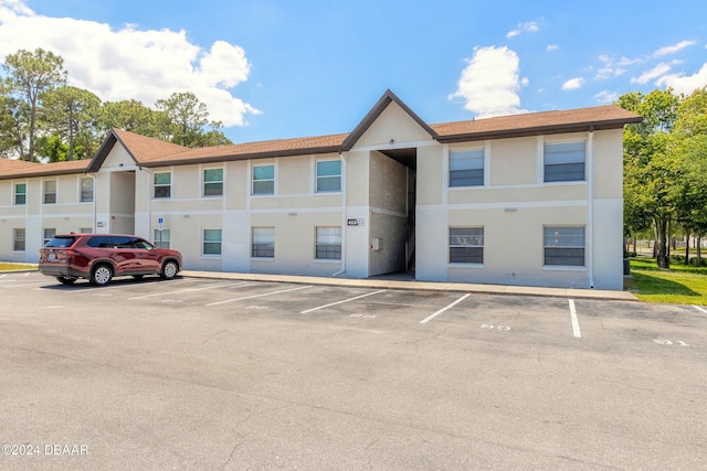415 Banana Cay Dr Unit F, South Daytona, FL 32119 - view of property with uncovered parking