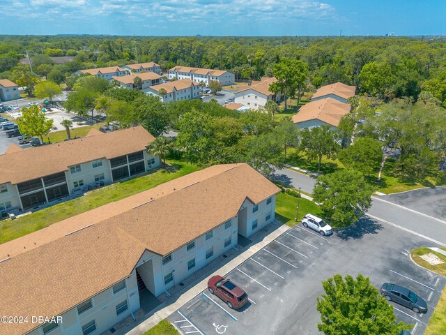 415 Banana Cay Dr Unit F, South Daytona, FL 32119 - aerial view of a heavily wooded area