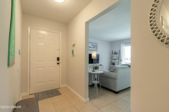 entrance foyer featuring light tile patterned flooring