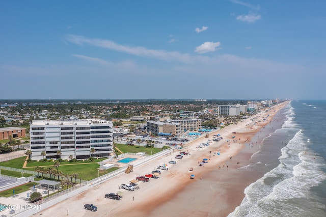 birds eye view of property featuring a view of the beach and a water view