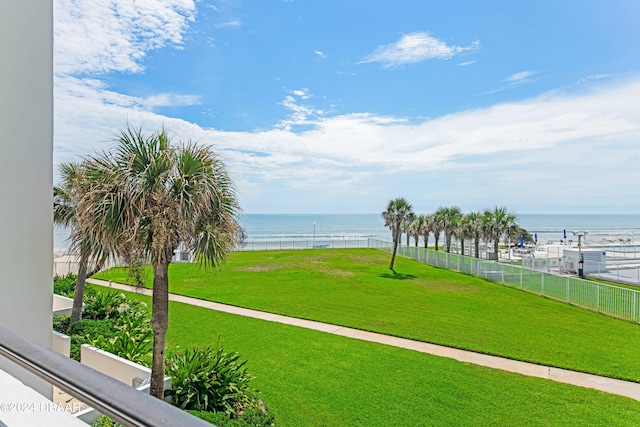 view of home's community featuring a water view and a yard