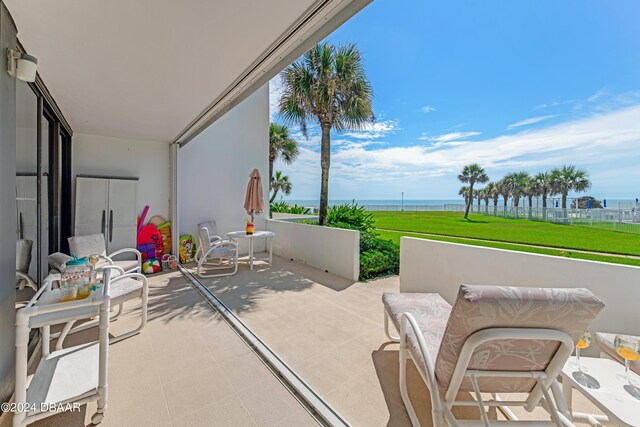 901 S Atlantic Ave Unit 102, Ormond Beach, FL 32176 - view of patio featuring a water view