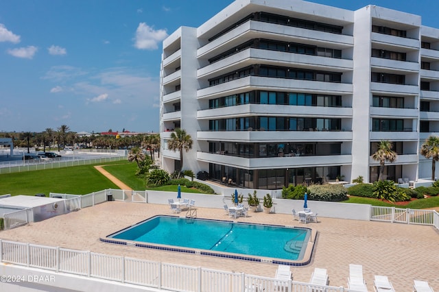 view of swimming pool with a patio