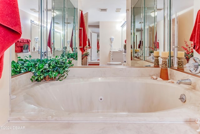 bathroom with tiled tub