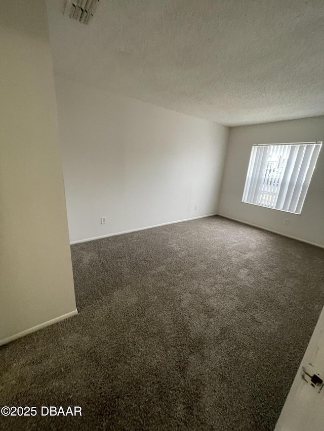 403 Banana Cay Dr Unit B, South Daytona, FL 32119 - carpeted empty room featuring a textured ceiling and baseboards