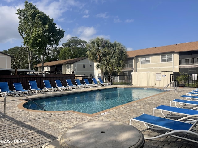 403 Banana Cay Dr Unit B, South Daytona, FL 32119 - community pool featuring a patio area