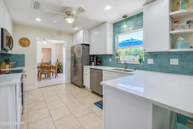 kitchen featuring a sink, visible vents, white cabinetry, appliances with stainless steel finishes, and open shelves