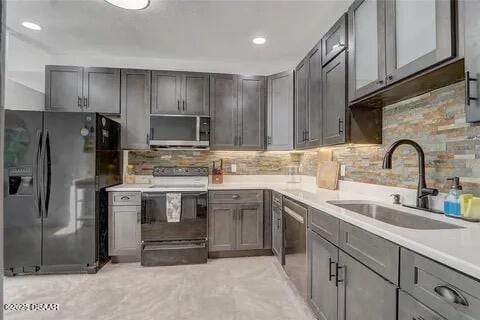 2144 Ridge Dr, Winter Park, FL 32792 - kitchen featuring appliances with stainless steel finishes, a sink, gray cabinets, light countertops, and recessed lighting