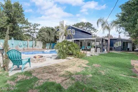 2144 Ridge Dr, Winter Park, FL 32792 - back of house featuring a fire pit and a patio