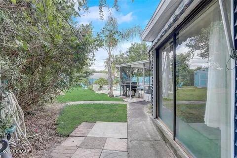 2144 Ridge Dr, Winter Park, FL 32792 - view of grassy yard with a patio
