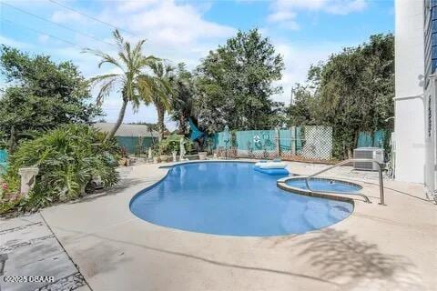 2144 Ridge Dr, Winter Park, FL 32792 - view of pool with a patio, fence, and a pool with connected hot tub