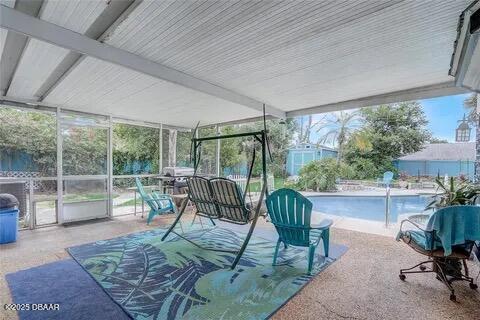 2144 Ridge Dr, Winter Park, FL 32792 - sunroom / solarium featuring expansive windows and healthy amount of natural light