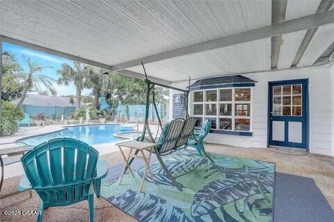 2144 Ridge Dr, Winter Park, FL 32792 - swimming pool featuring a patio and fence