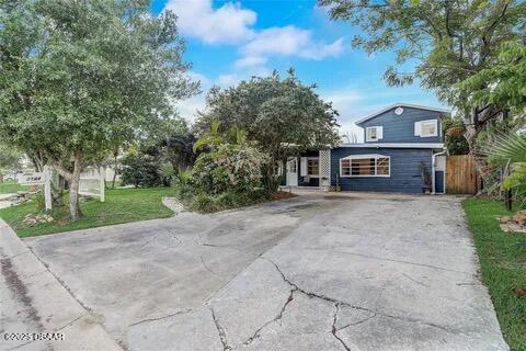 2144 Ridge Dr, Winter Park, FL 32792 - view of front facade featuring driveway and fence