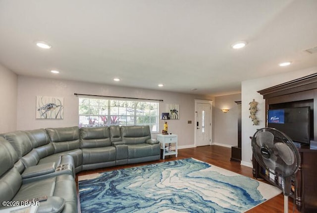 living room with baseboards, wood finished floors, and recessed lighting