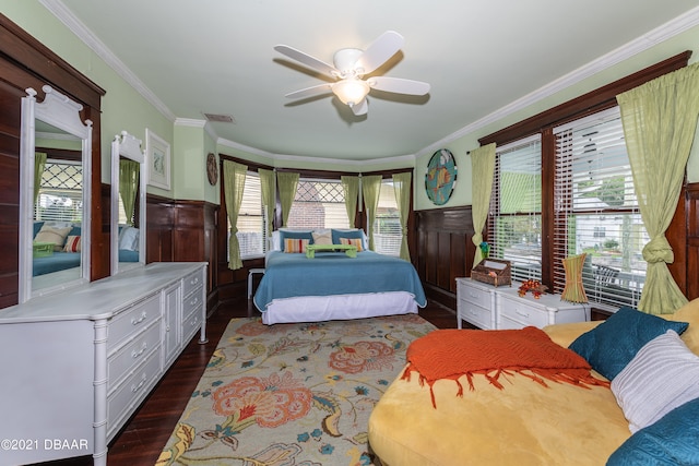 bedroom with multiple windows, crown molding, ceiling fan, and dark hardwood / wood-style floors